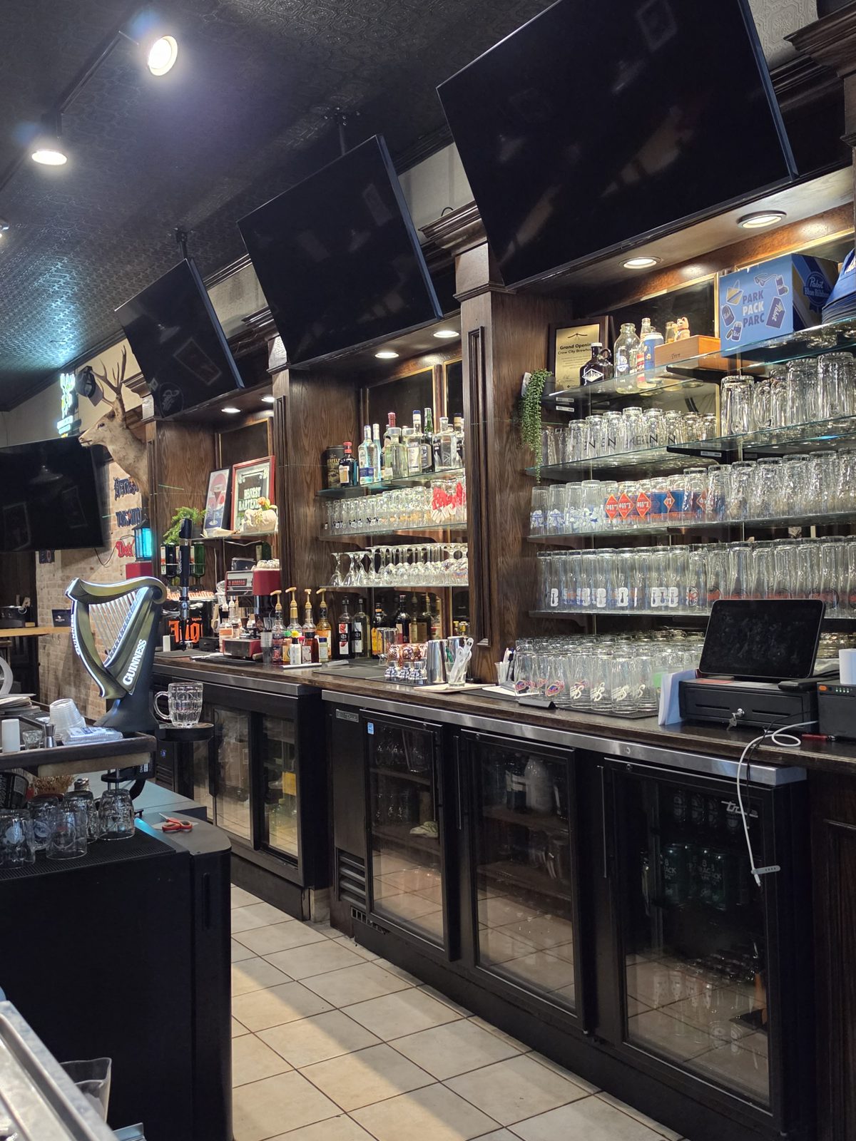 Back bar with TVs, glassware and coolers