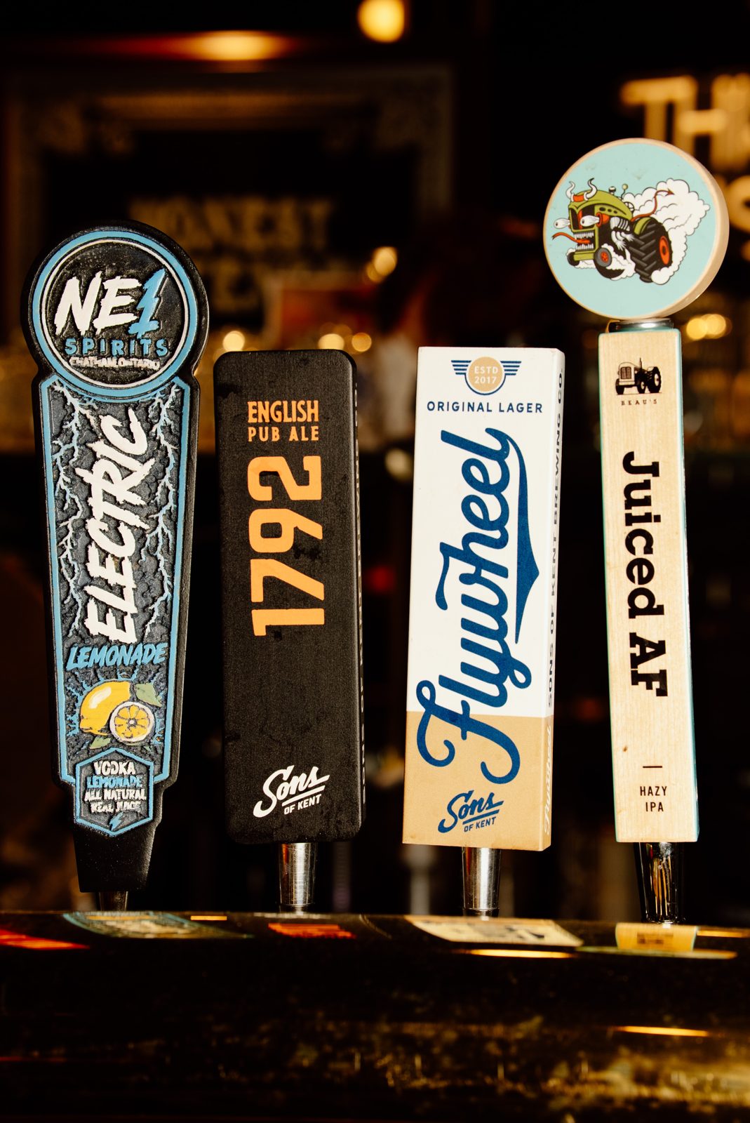 Tap handles including NE1 Electric Lemonade, Sons of Kent 1792 English Pub Ale, Sons of Kent Flywheel lager and Juiced AF hazy IPA